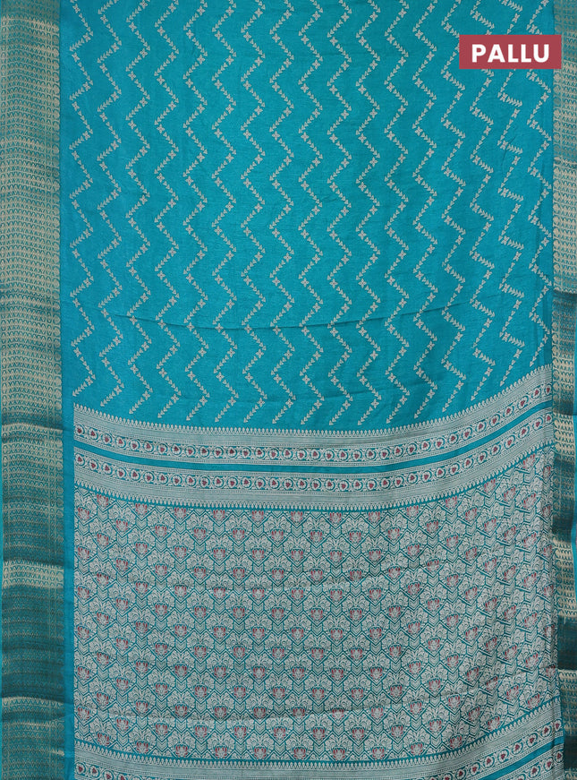 Semi dola saree teal blue with allover zig zag prints and zari woven border