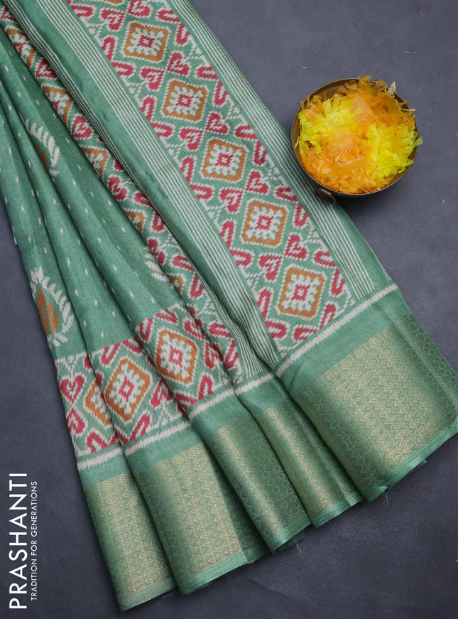 Semi dola saree pastel green with allover prints and zari woven border