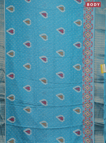 Semi dola saree teal blue with allover prints and zari woven border