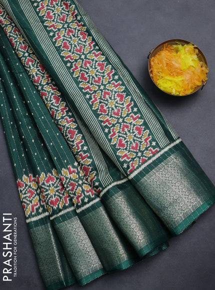 Semi dola saree bottle green with allover ikat butta prints & zari weaves and zari woven border