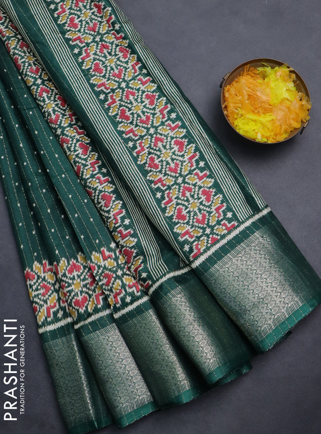 Semi dola saree bottle green with allover ikat butta prints & zari weaves and zari woven border