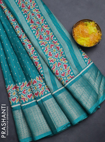 Semi dola saree teal green with allover ikat butta prints & zari weaves and zari woven border