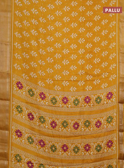 Semi dola saree mustard yellow with allover ikat butta prints and zari woven border
