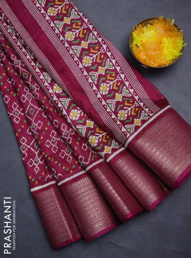 Semi dola saree wine shade with allover ikat prints and zari woven border