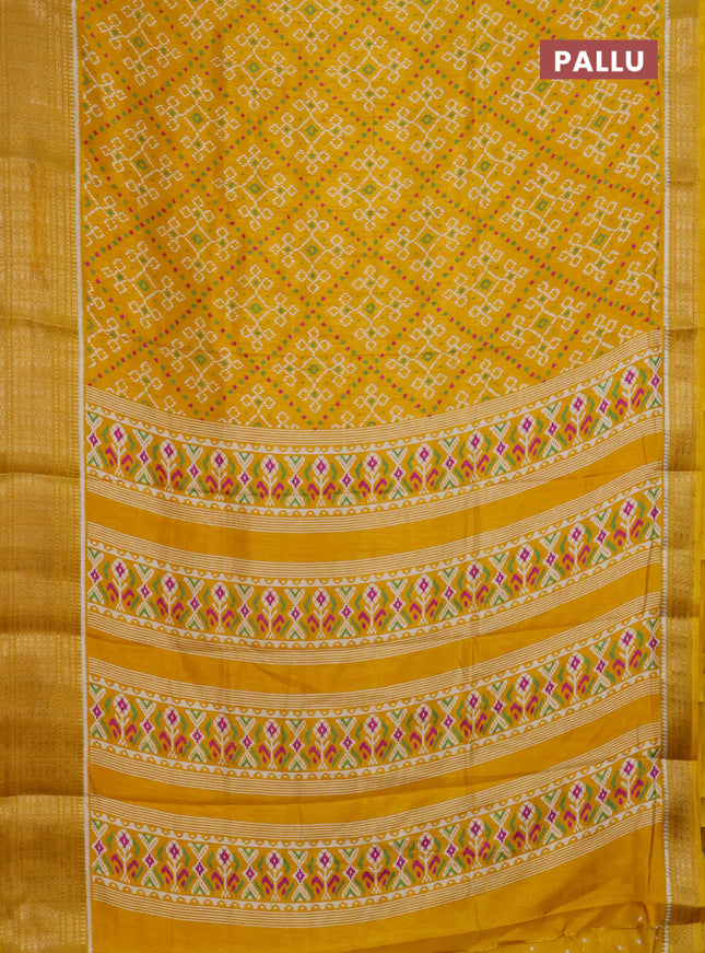 Semi dola saree mustard yellow with allover ikat prints and zari woven border