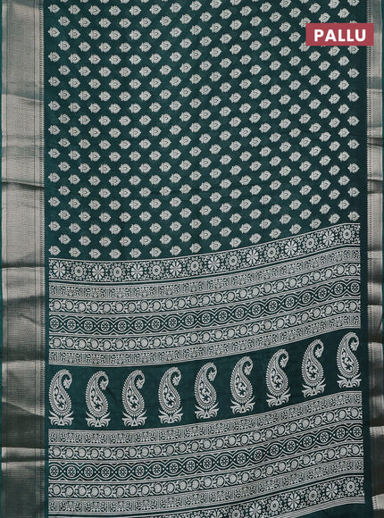Semi dola saree dark green with allover butta prints and zari woven border