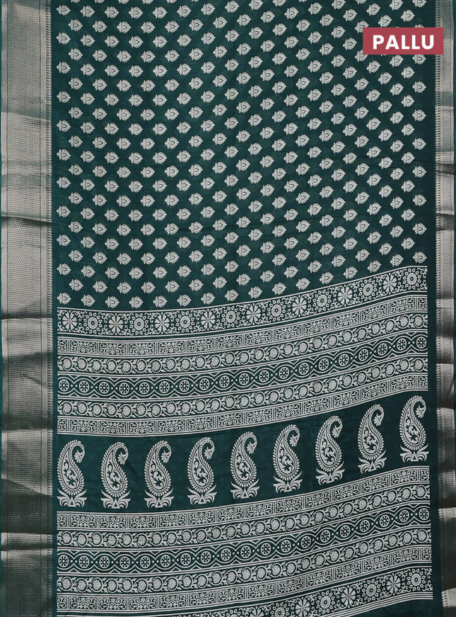 Semi dola saree dark green with allover butta prints and zari woven border