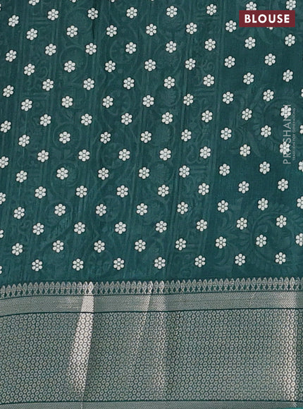 Semi dola saree dark green with allover butta prints and zari woven border