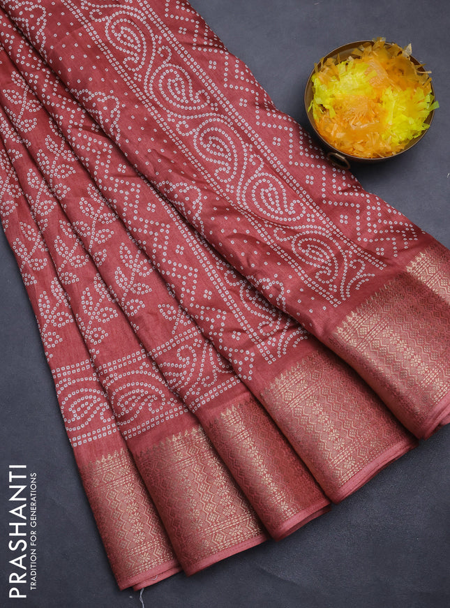 Semi dola saree maroon with allover bandhani prints and zari woven border