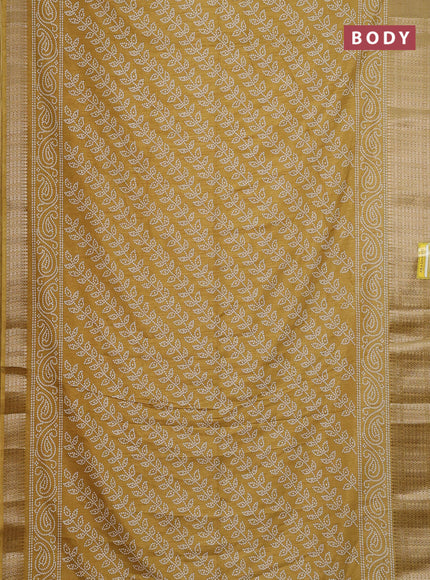Semi dola saree yellow with allover bandhani prints and zari woven border