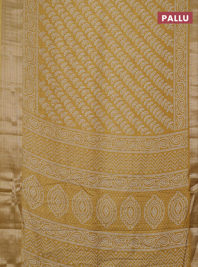 Semi dola saree yellow with allover bandhani prints and zari woven border
