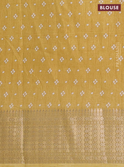 Semi dola saree yellow with allover bandhani prints and zari woven border
