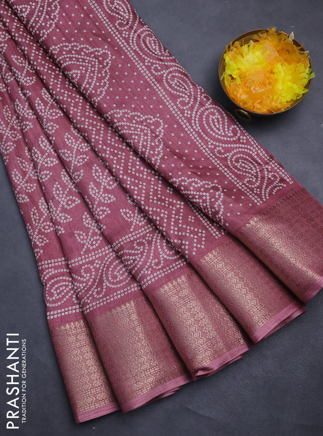 Semi dola saree mauve pink with allover bandhani prints and zari woven border