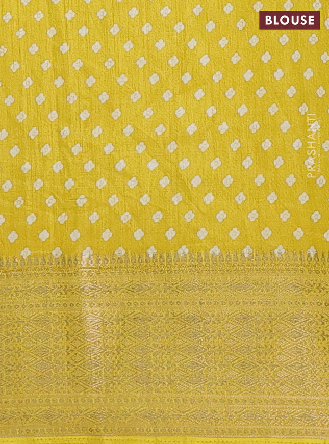 Semi dola saree yellow with allover prints and zari woven border