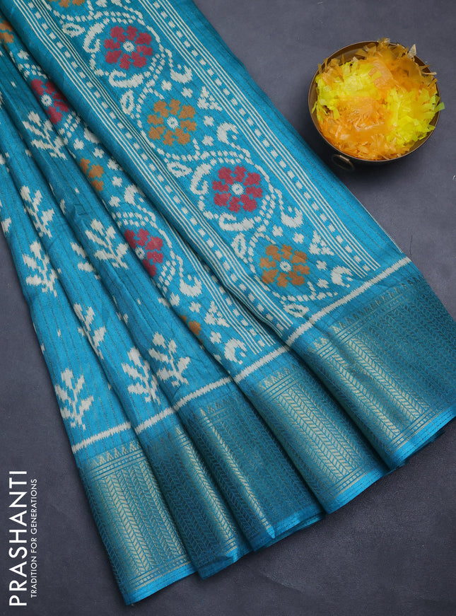 Semi dola saree teal blue with allover ikat butta prints & zari weaves and zari woven border