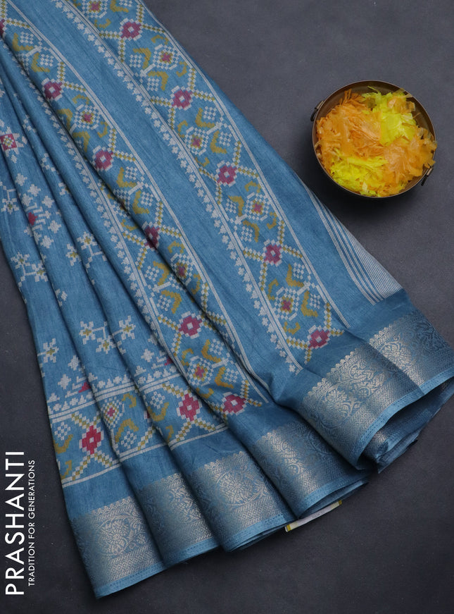 Semi dola saree pastel blue with allover ikat prints and zari woven border