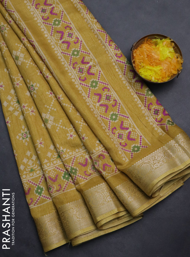 Semi dola saree mustard shade with allover ikat prints and zari woven border