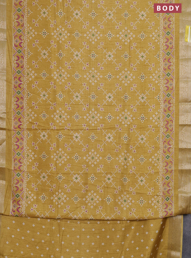 Semi dola saree mustard shade with allover ikat prints and zari woven border