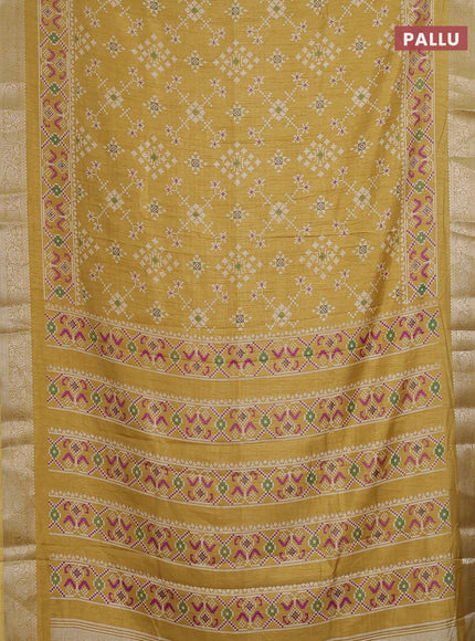 Semi dola saree mustard shade with allover ikat prints and zari woven border