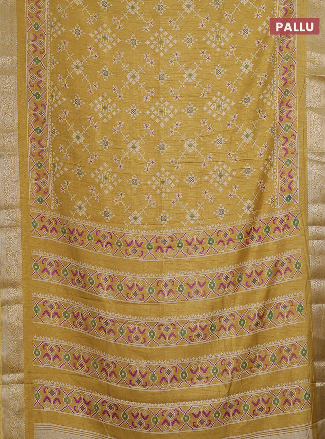 Semi dola saree mustard shade with allover ikat prints and zari woven border