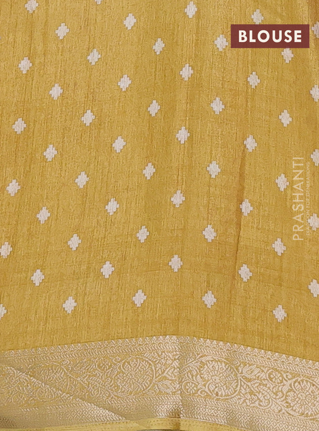 Semi dola saree mustard shade with allover ikat prints and zari woven border