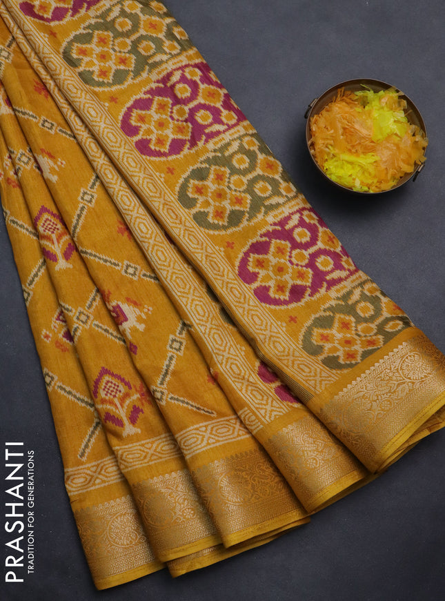 Semi dola saree mustard yellow with allover patola prints and zari woven border