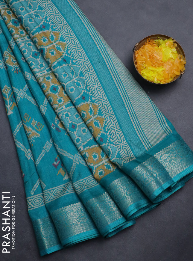 Semi dola saree teal green with allover patola prints and zari woven border