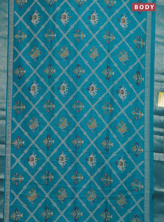 Semi dola saree teal green with allover patola prints and zari woven border