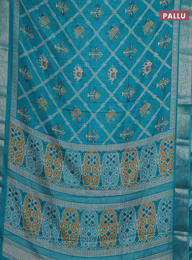 Semi dola saree teal green with allover patola prints and zari woven border