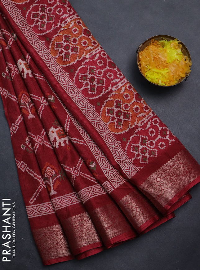Semi dola saree maroon with allover patola prints and zari woven border