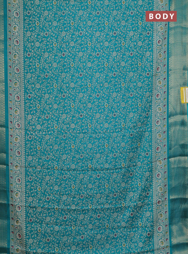 Semi dola saree teal green with allover prints and zari woven border