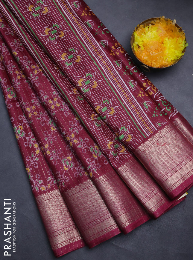 Semi dola saree wine shade with allover prints & zari weaves and zari woven border