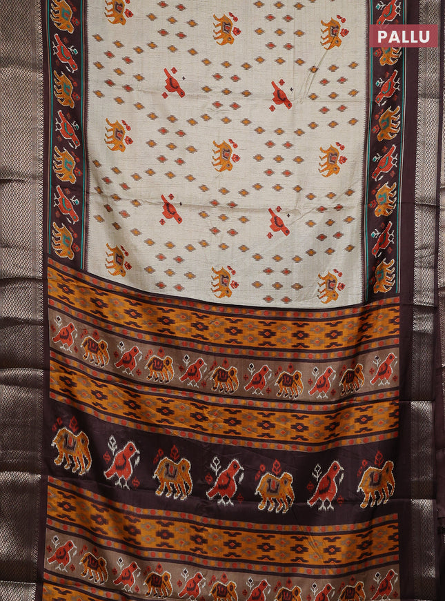 Semi dola saree cream and brown with allover patola prints and zari woven border