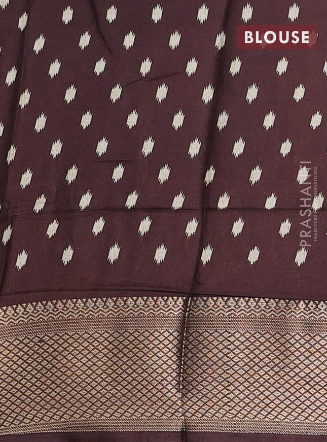 Semi dola saree cream and brown with allover patola prints and zari woven border