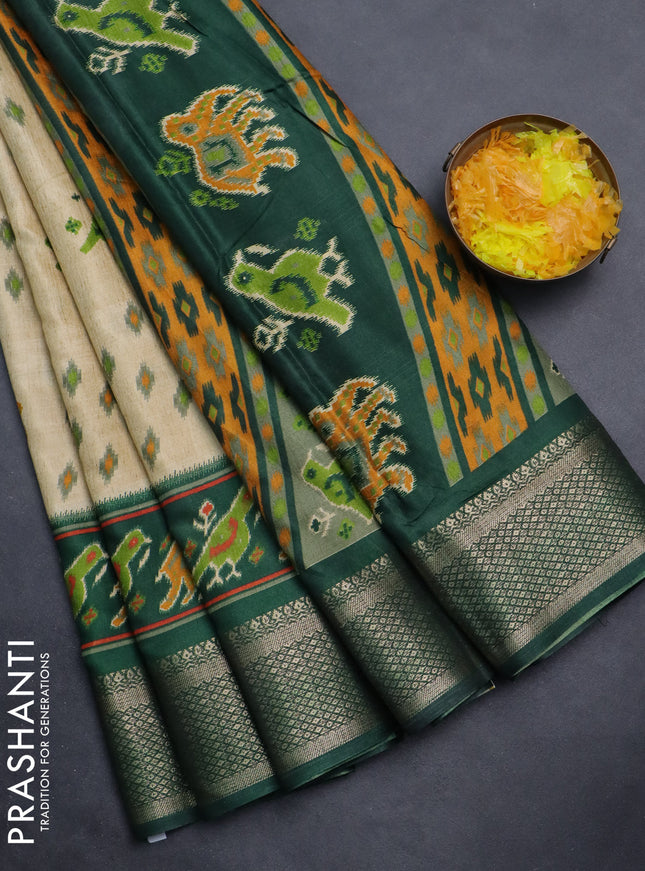 Semi dola saree sandal and green with allover patola prints and zari woven border