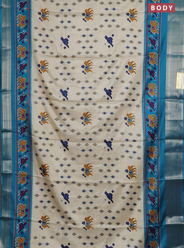 Semi dola saree cream and teal blue with allover patola prints and zari woven border