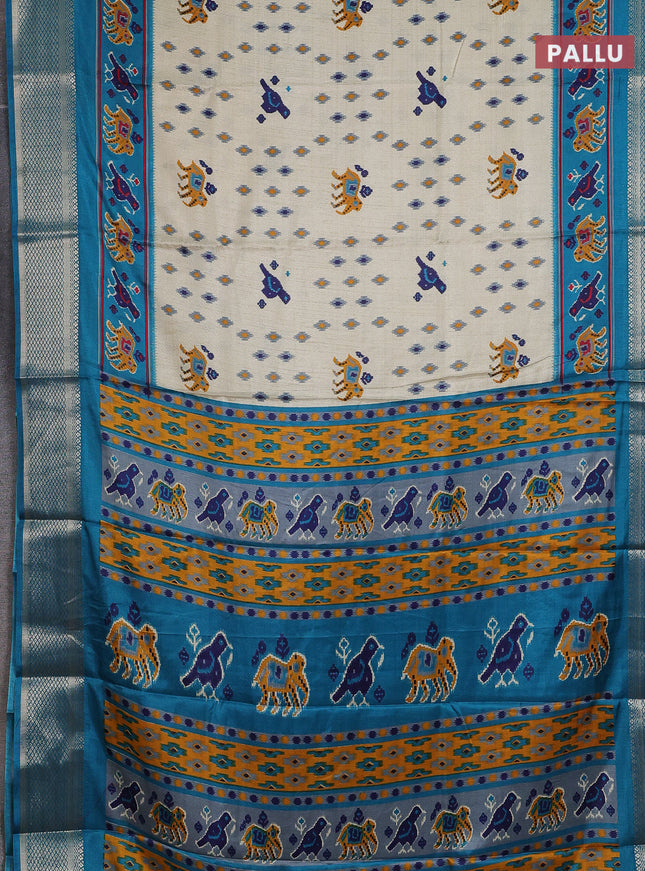Semi dola saree cream and teal blue with allover patola prints and zari woven border