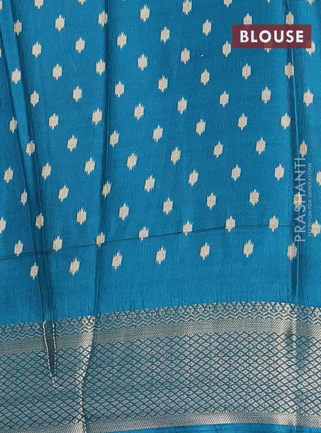 Semi dola saree cream and teal blue with allover patola prints and zari woven border