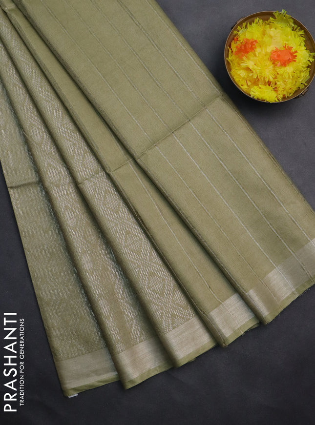 Semi munga jacquard saree pastel green with allover silver zari weaves and zari woven border