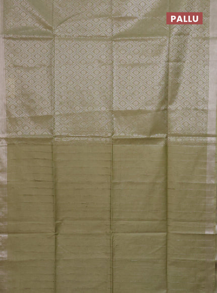 Semi munga jacquard saree pastel green with allover silver zari weaves and zari woven border