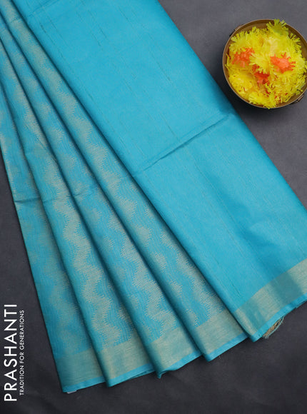 Semi munga jacquard saree teal blue with allover zari weaves and zari woven border