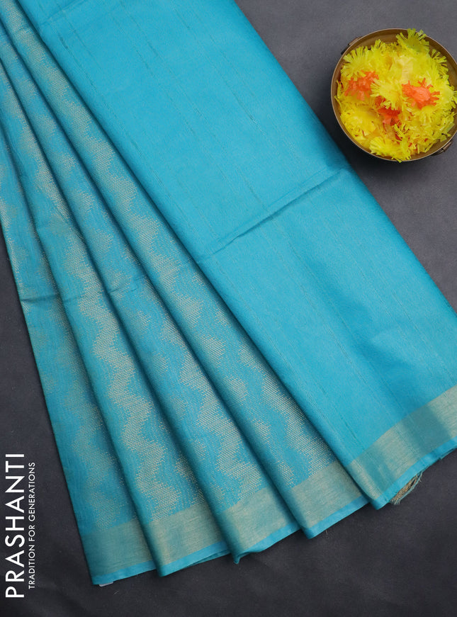 Semi munga jacquard saree teal blue with allover zari weaves and zari woven border