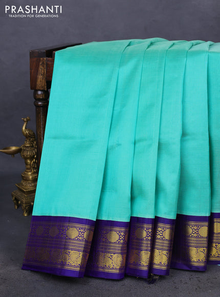 Kuppadam silk cotton saree teal green and blue with plain body and zari woven border
