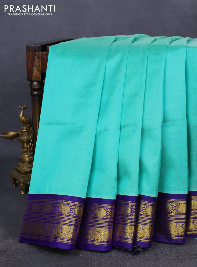 Kuppadam silk cotton saree teal green and blue with plain body and zari woven border