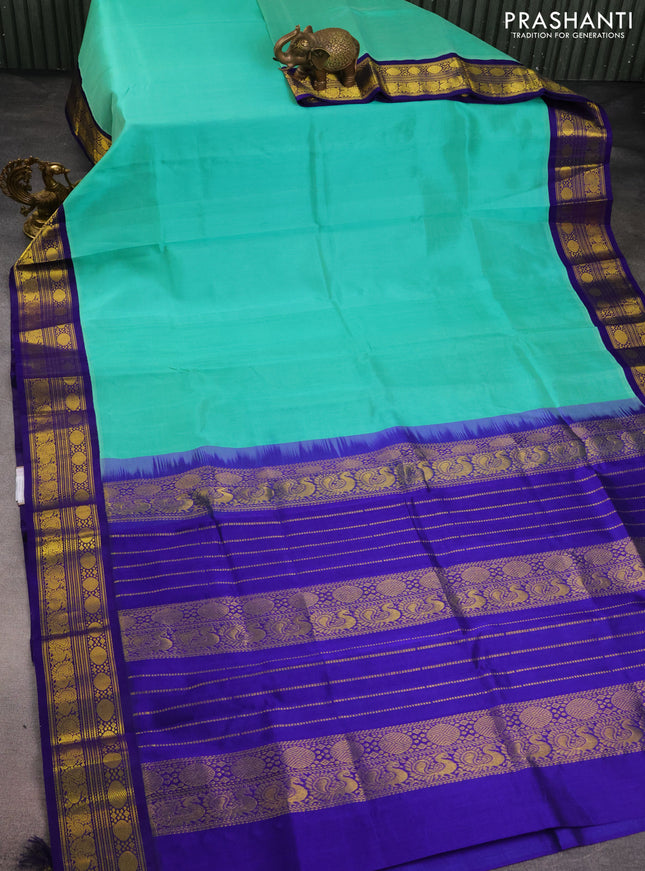 Kuppadam silk cotton saree teal green and blue with plain body and zari woven border