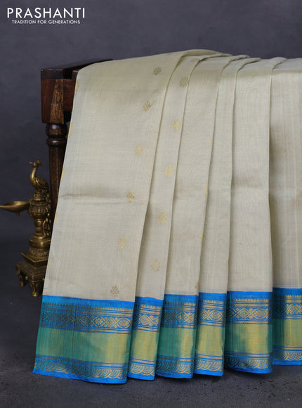 Kuppadam silk cotton saree beige and cs blue with zari woven buttas and zari woven border