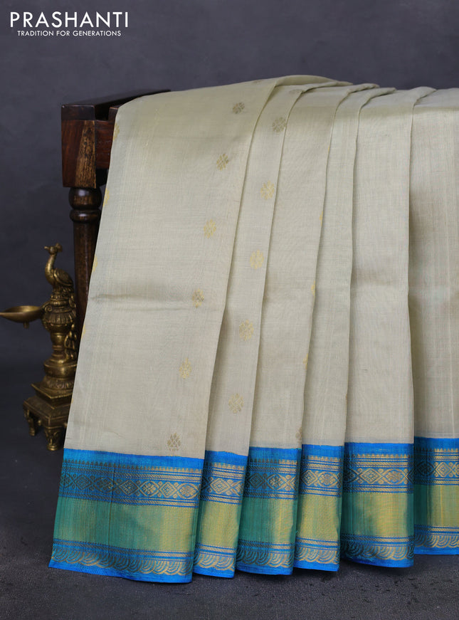Kuppadam silk cotton saree beige and cs blue with zari woven buttas and zari woven border