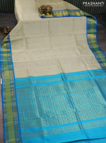 Kuppadam silk cotton saree beige and cs blue with zari woven buttas and zari woven border