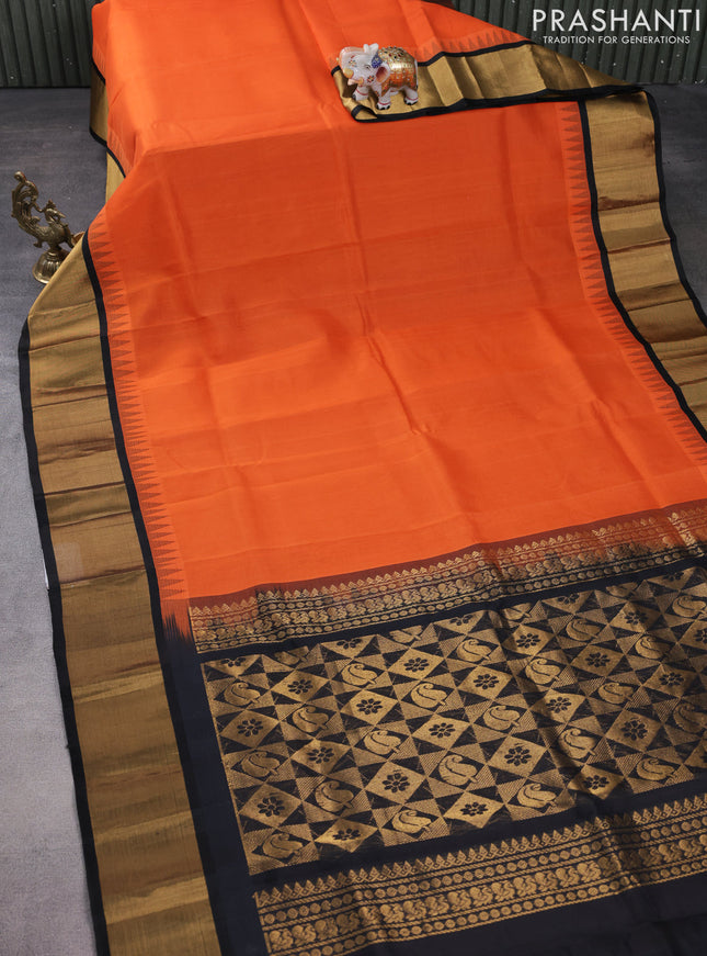 Kuppadam silk cotton saree orange and black with plain body and temple design zari woven border