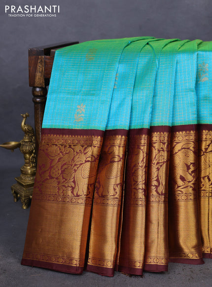 Kuppadam silk cotton saree dual shade of teal blue and deep maroon with allover zari checked pattern and long zari woven border